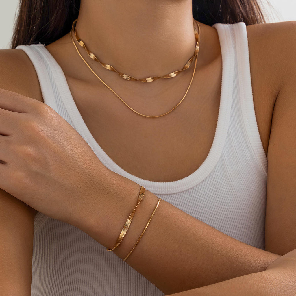 MÖBIU™ Set Parure Sinuosa – Collana e Bracciale a Serpente in Acciaio Placcato Oro